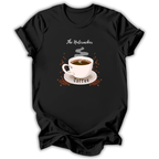 A black short-sleeve t-shirt with a graphic print of a white coffee cup on a saucer, surrounded by coffee beans and the words 'The Nutcracker' and 'Coffee'.