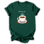 A dark green short-sleeve t-shirt with a graphic print of a white coffee cup on a saucer, surrounded by coffee beans and steam, with the text 'The Nutcracker' above and 'Coffee' below.