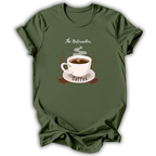 An olive green short-sleeve t-shirt with a graphic print of a white coffee cup on a saucer, surrounded by small red dots and the words 'The Nutcracker' and 'Coffee'.