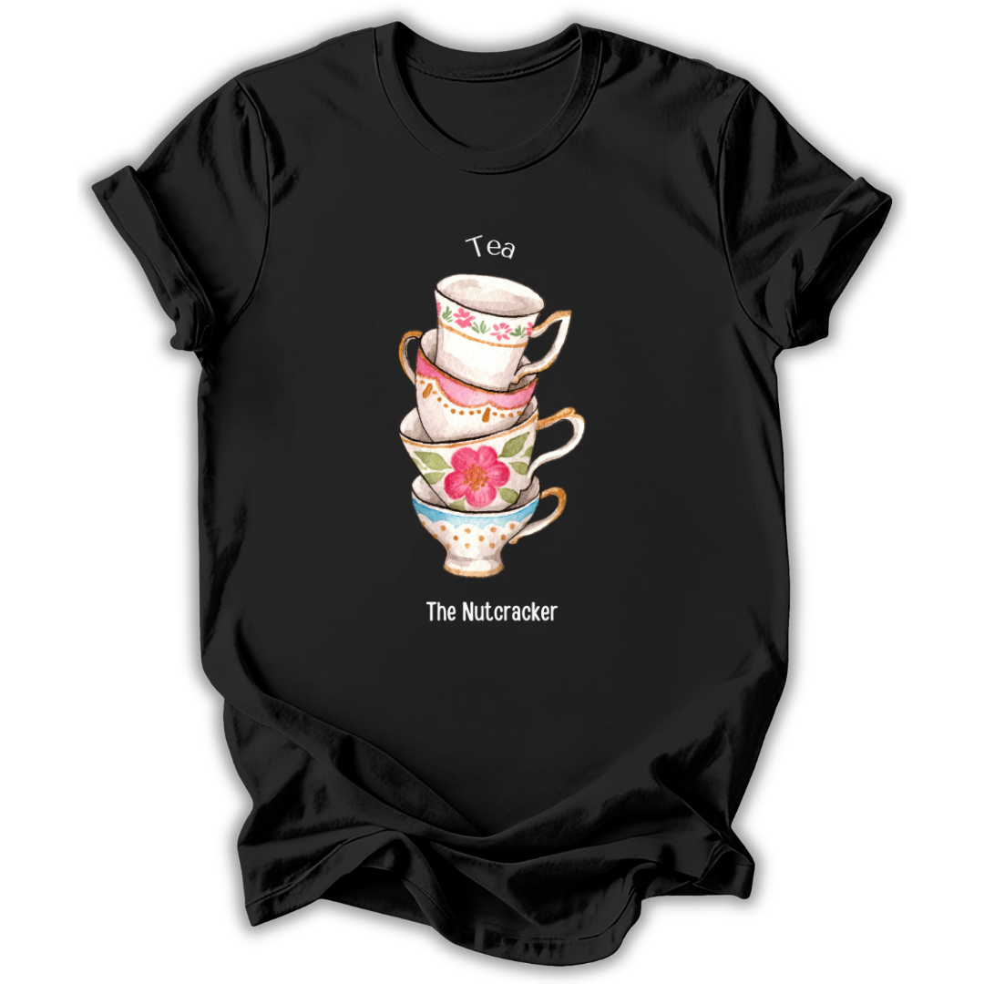 A black short-sleeve t-shirt with a graphic of a stack of four colorful teacups and the text 'Tea' above and 'The Nutcracker' below, displayed on a clean white background.