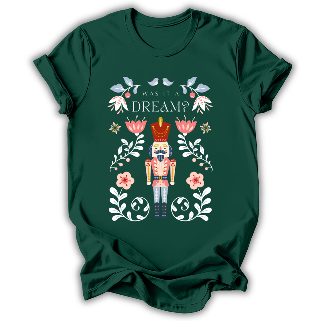 A dark charcoal gray t-shirt with a graphic print of a nutcracker surrounded by flowers and the text 'IN MY NUTCRACKER MOM ERA'.