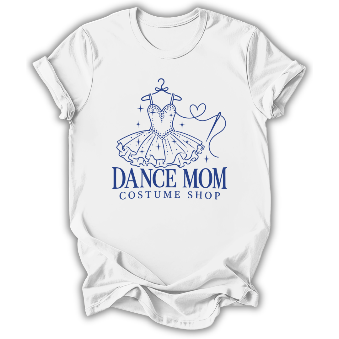 A white short-sleeve crewneck t-shirt with a blue graphic of a tutu dress on a hanger and the text 'DANCE MOM COSTUME SHOP' printed on the front, displayed against a clean white background.