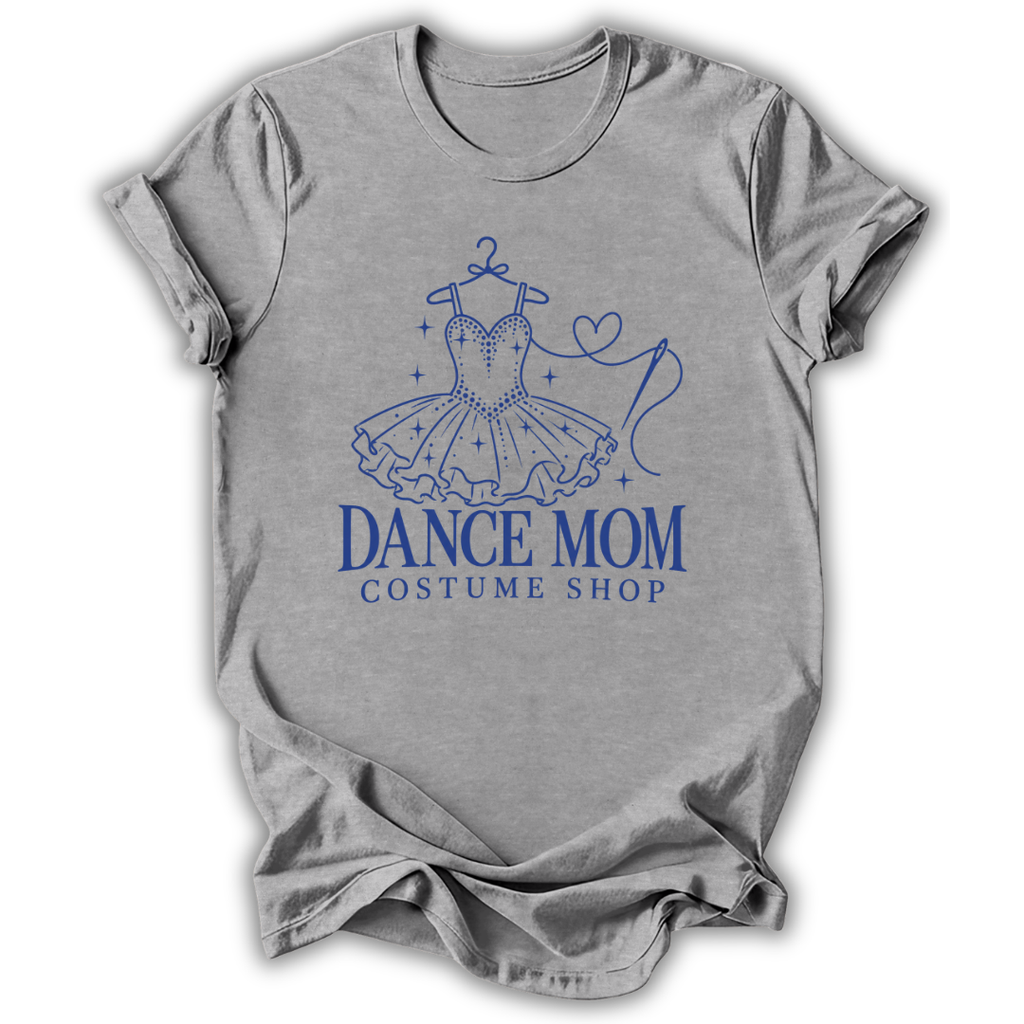 A heather gray short-sleeve t-shirt with a blue graphic of a ballroom dance dress on a hanger and the text 'DANCE MOM COSTUME SHOP' printed on the front, shown against a plain white background.