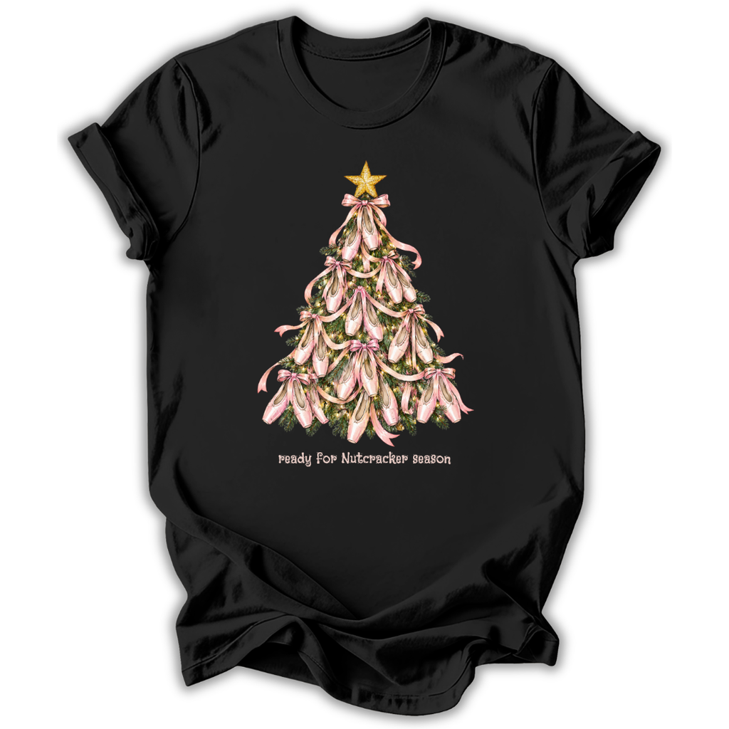 A black short-sleeve crewneck t-shirt featuring a graphic of a Christmas tree made of pink lilies with a gold star on top, and the text 'ready for Nutcracker season' printed below.