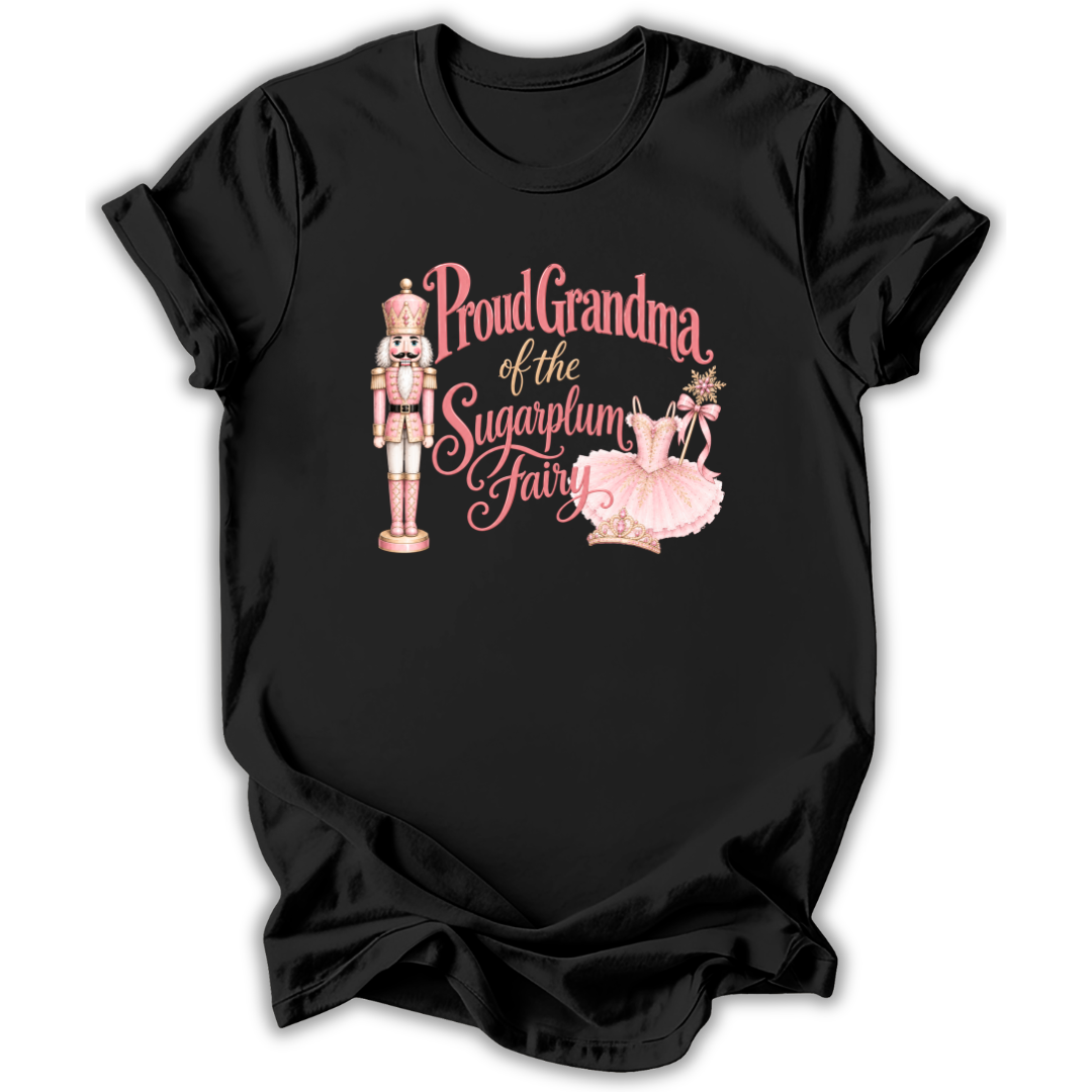 A black short-sleeve t-shirt with a graphic print on the front featuring a nutcracker, ballerina, and the text 'Proud Grandma of the Sugarplum Fairy' in pink and gold lettering.