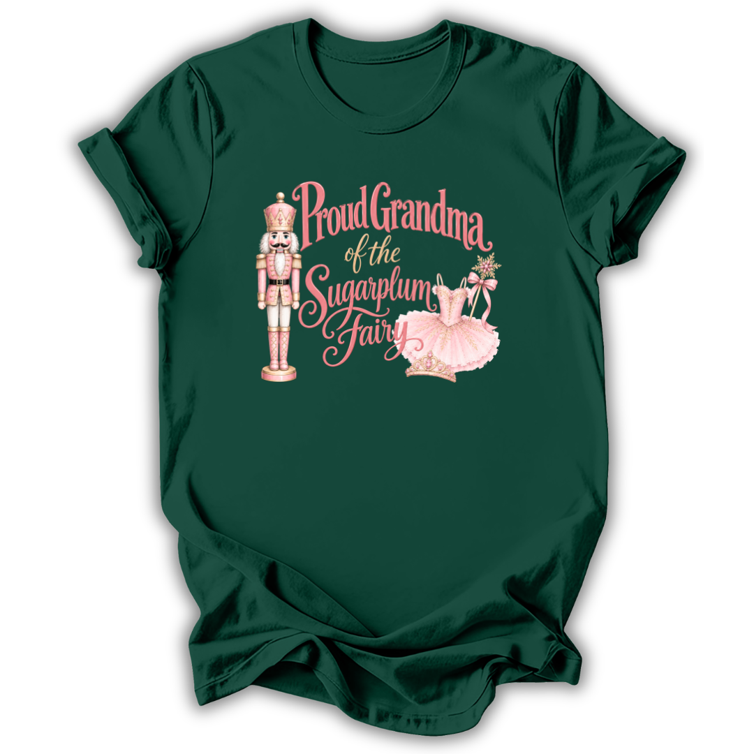A dark green short-sleeve t-shirt with a graphic on the front featuring a nutcracker, a pink tutu, and the text 'Proud Grandma of the Sugarplum Fairy' in pink script.