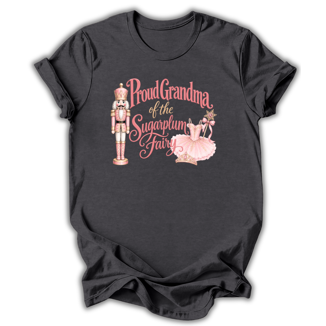 A dark charcoal gray t-shirt with a graphic print featuring a nutcracker, ballerina, and the text 'Proud Grandma of the Sugarplum Fairy' in pink and gold lettering.