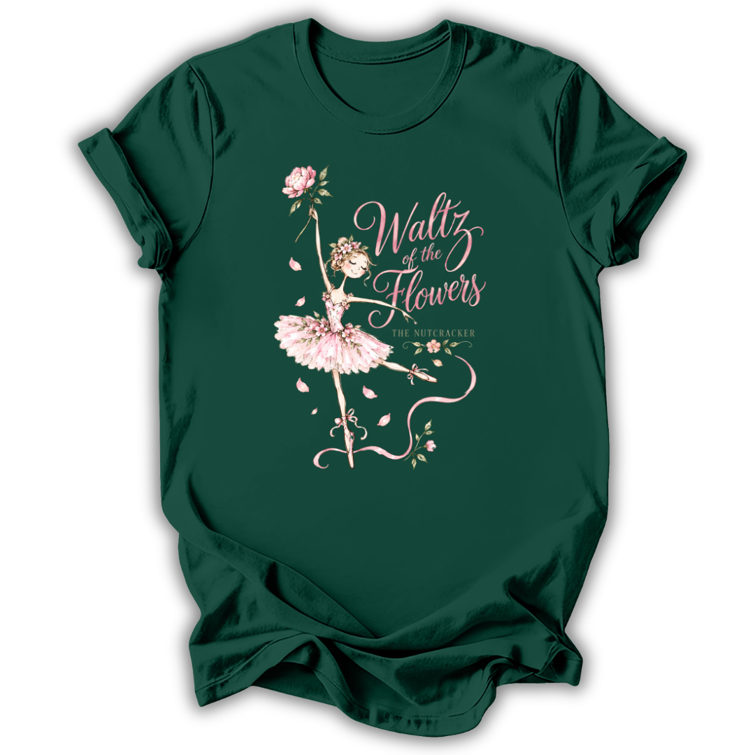 A dark green short-sleeve t-shirt with a graphic print of a ballerina with a pink tutu and roses, next to the text 'Waltz of the Flowers' and 'THE MYSTIC ORDER'.