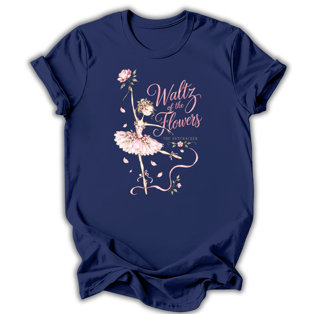 A navy blue short-sleeve t-shirt with a graphic print of a ballerina in a pink tutu and the text 'Waltz of the Flowers' in pink script, displayed against a white background.