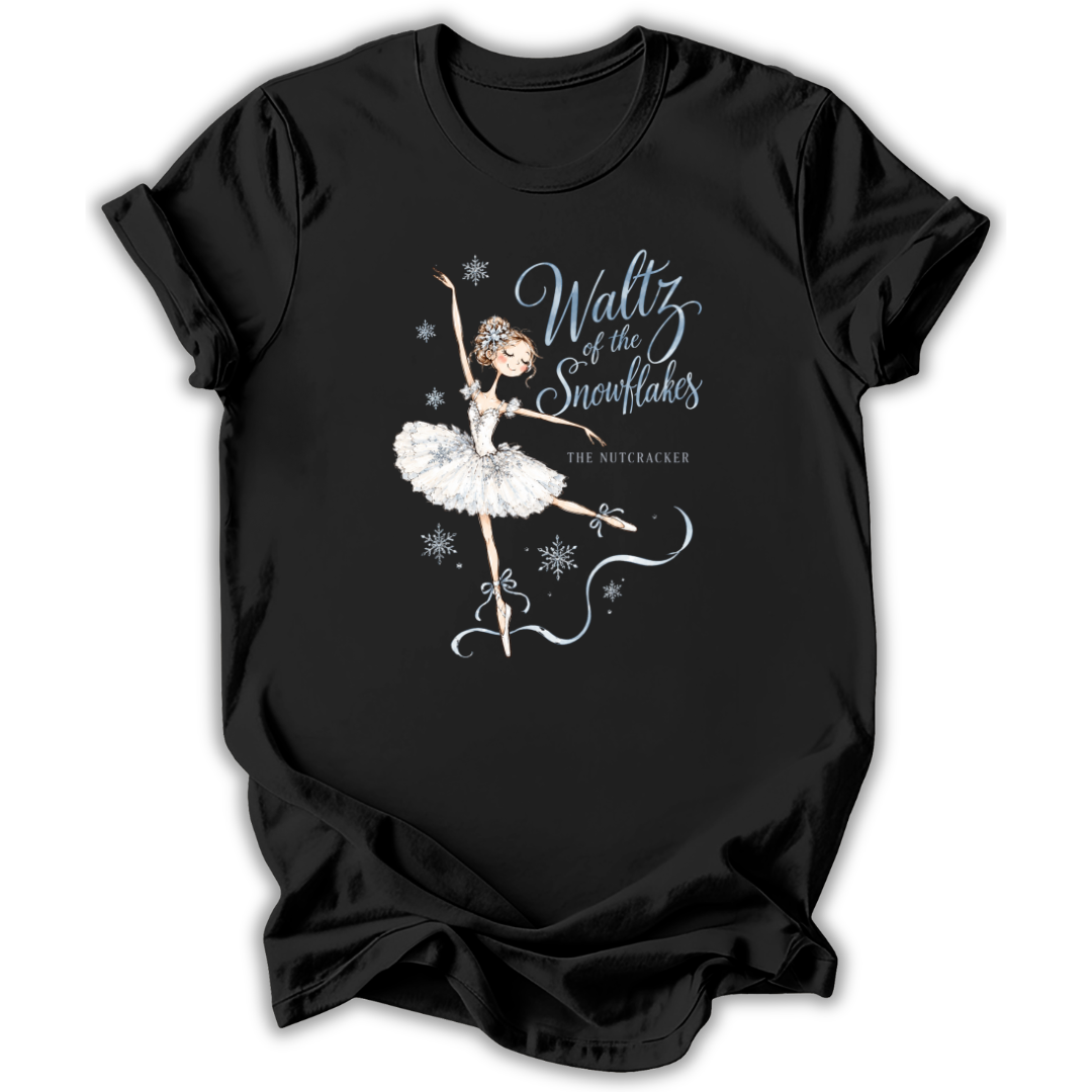 A black short-sleeve t-shirt with a graphic of a ballet dancer in a white tutu and the text 'Waltz of the Snowflakes' and 'The Nutcracker' printed on the front, displayed against a plain white background.