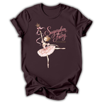 A dark plum short-sleeve t-shirt with a graphic of a ballerina in a pink tutu holding a wand, with the text 'Sugarplum Fairy' and 'The Astronomer' printed on the front.