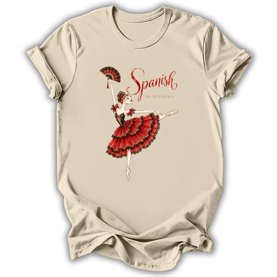 A beige short-sleeve t-shirt with a graphic print of a Spanish dancer in a red and black dress, holding a red fan, with the text 'Spanish' and 'by the metropolis' printed on the front.