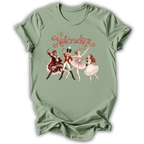 A sage green short-sleeve t-shirt with a vintage-style graphic of 'The Nutcracker' characters (a nutcracker, a ballerina, and a fairy) and the title 'The Nutcracker 2026' printed on the chest.