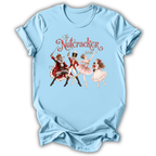 A light blue short-sleeve t-shirt with a vintage-style graphic of 'The Nutcracker' characters from the 2020 holiday season, displayed on a clean white background.
