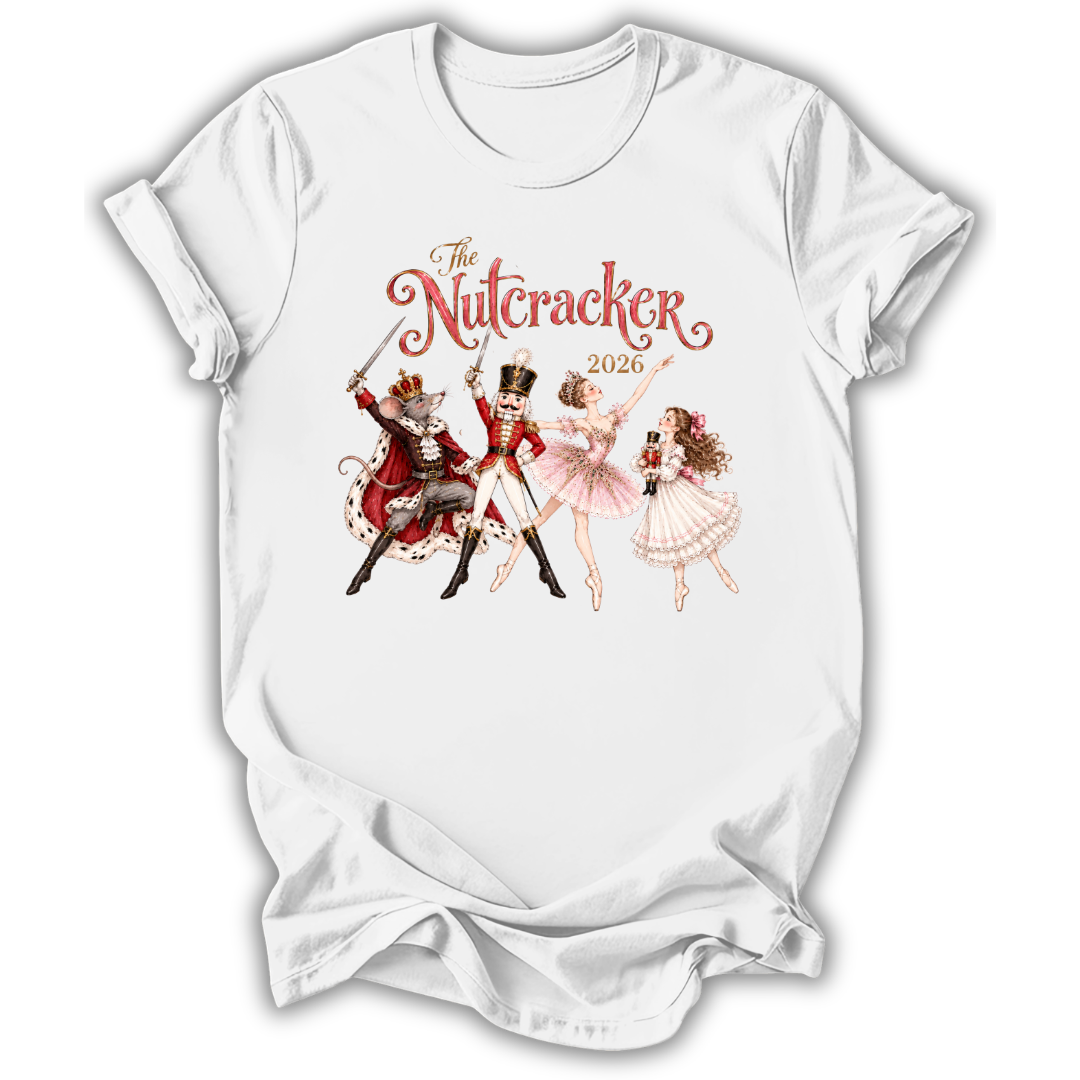 A white short-sleeve crewneck t-shirt featuring a vintage-style graphic of 'The Nutcracker' characters from the movie, including the nutcracker, soldier, ballerina, and fairy, with the text 'The Nutcracker 2020' in red and brown script.
