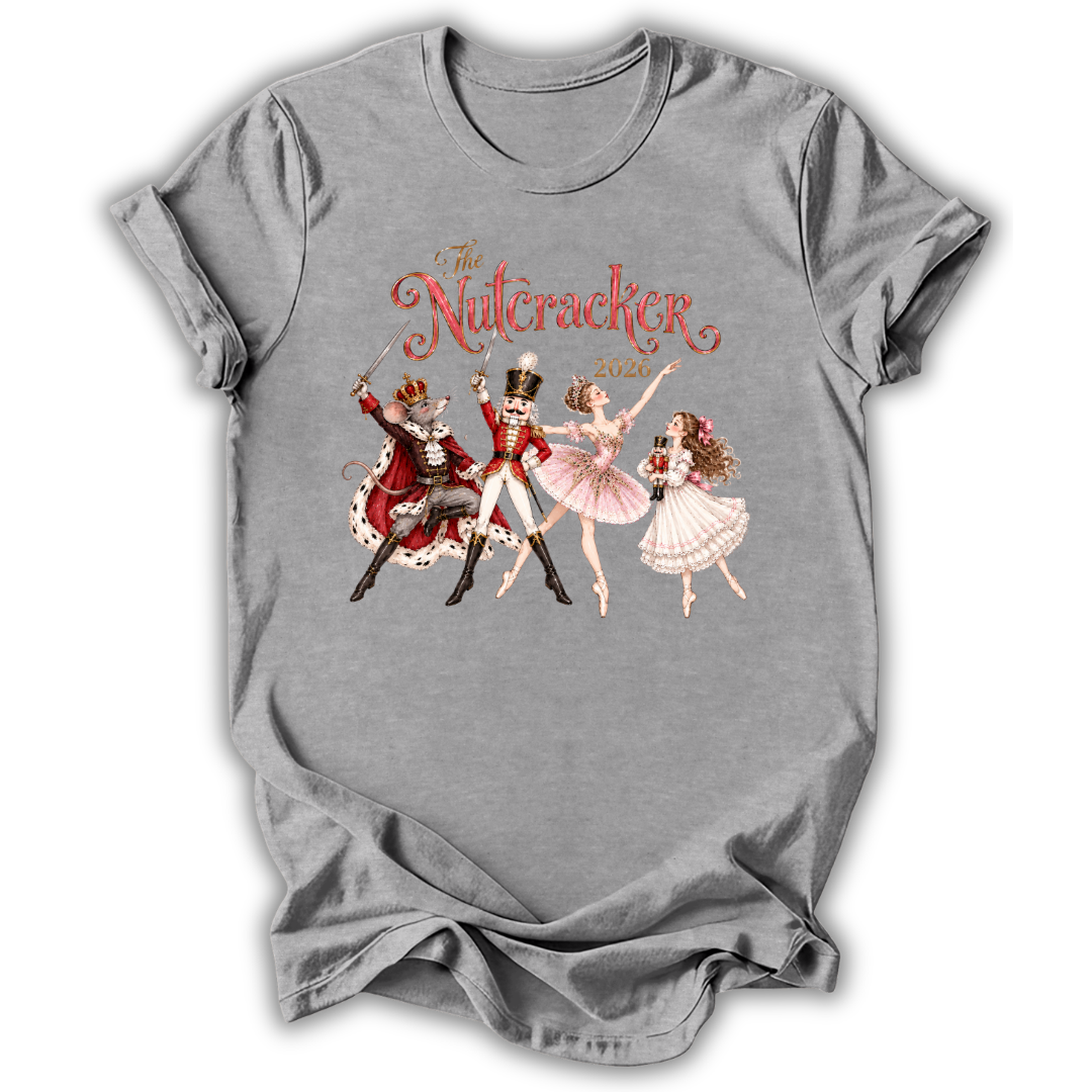 A gray short-sleeve crewneck t-shirt featuring a vintage-style graphic of 'The Nutcracker Ballet' with illustrations of the characters and red script text, displayed on a clean white background.