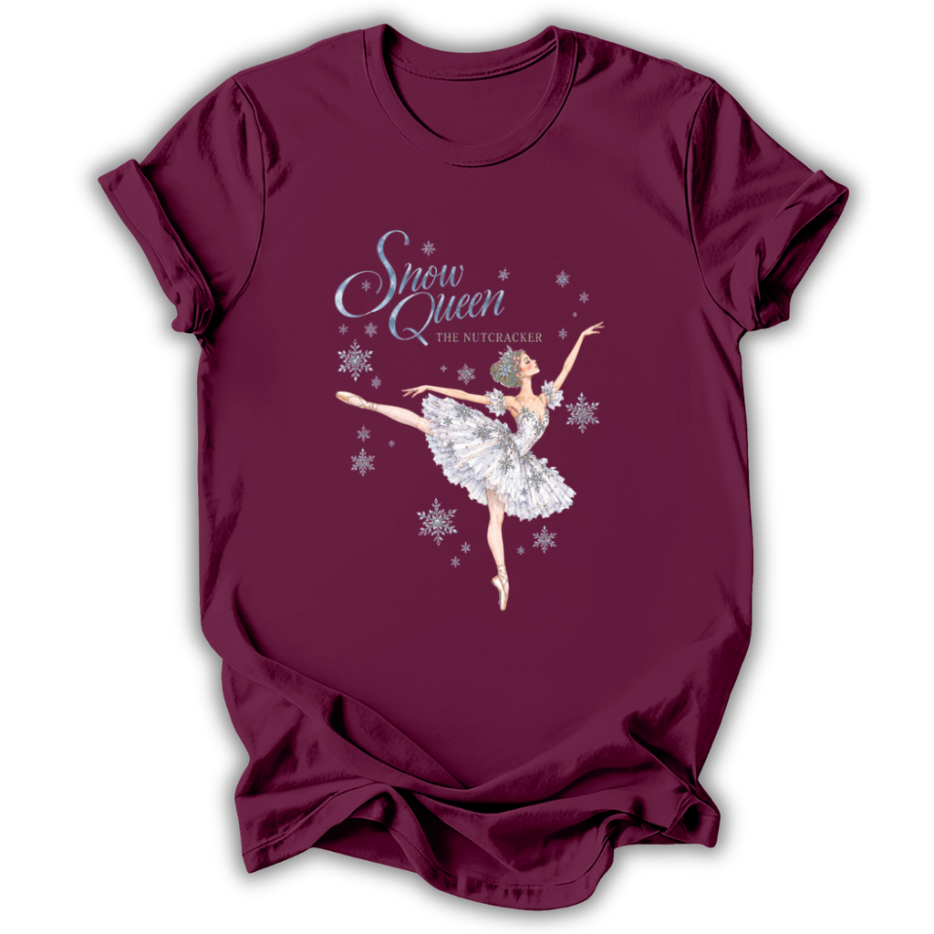 A maroon short-sleeve t-shirt with a graphic of a ballet dancer in a white tutu under the text 'Snow Queen The Nutcracker' with silver snowflakes, displayed on a white background.