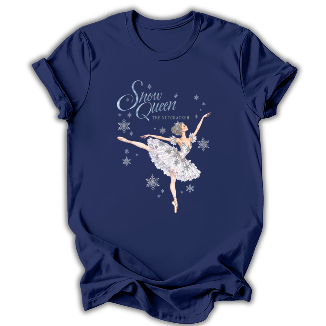 A navy blue short-sleeve t-shirt with a graphic of the Snow Queen from The Nutcracker ballet dancing amidst white snowflakes. The text 'Snow Queen' and 'THE NUTCRAKER' is printed in white and silver on the front.