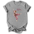 A heather gray short-sleeve t-shirt with a graphic of a dancing Arabian woman in a pink and gold outfit, with the text 'Arabian The Alchemist' printed on the front.