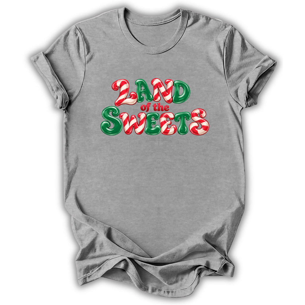 A heather gray short-sleeve t-shirt with a festive graphic reading 'LAND of the SWEETS' in red and green candy-cane-stripe-style lettering, shown on a plain white background.