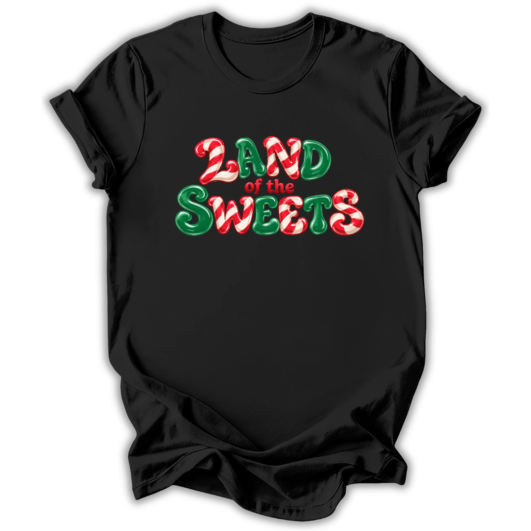 A black short-sleeve crewneck t-shirt with a festive graphic reading 'LAND of the SWEETS' in red and green candy cane patterns, displayed on a clean white background.