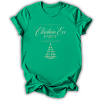 A bright green short-sleeve t-shirt with a gold printed Christmas Eve party invitation design on the front, displayed against a clean white background.