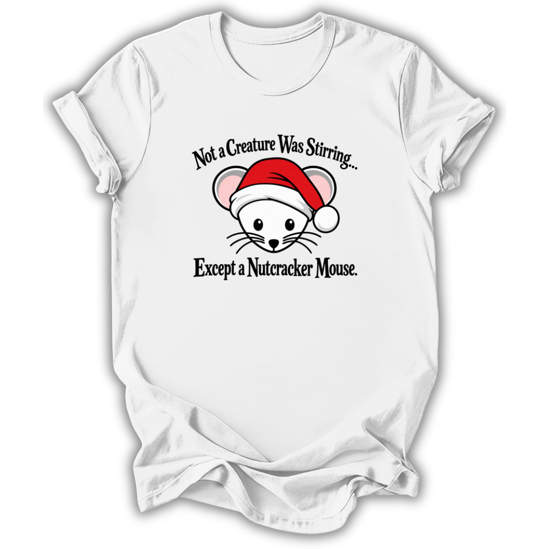 A white short-sleeve crewneck t-shirt with a graphic of a nutcracker mouse wearing a red Santa hat, with the text 'Not a Creature Was Stirring.