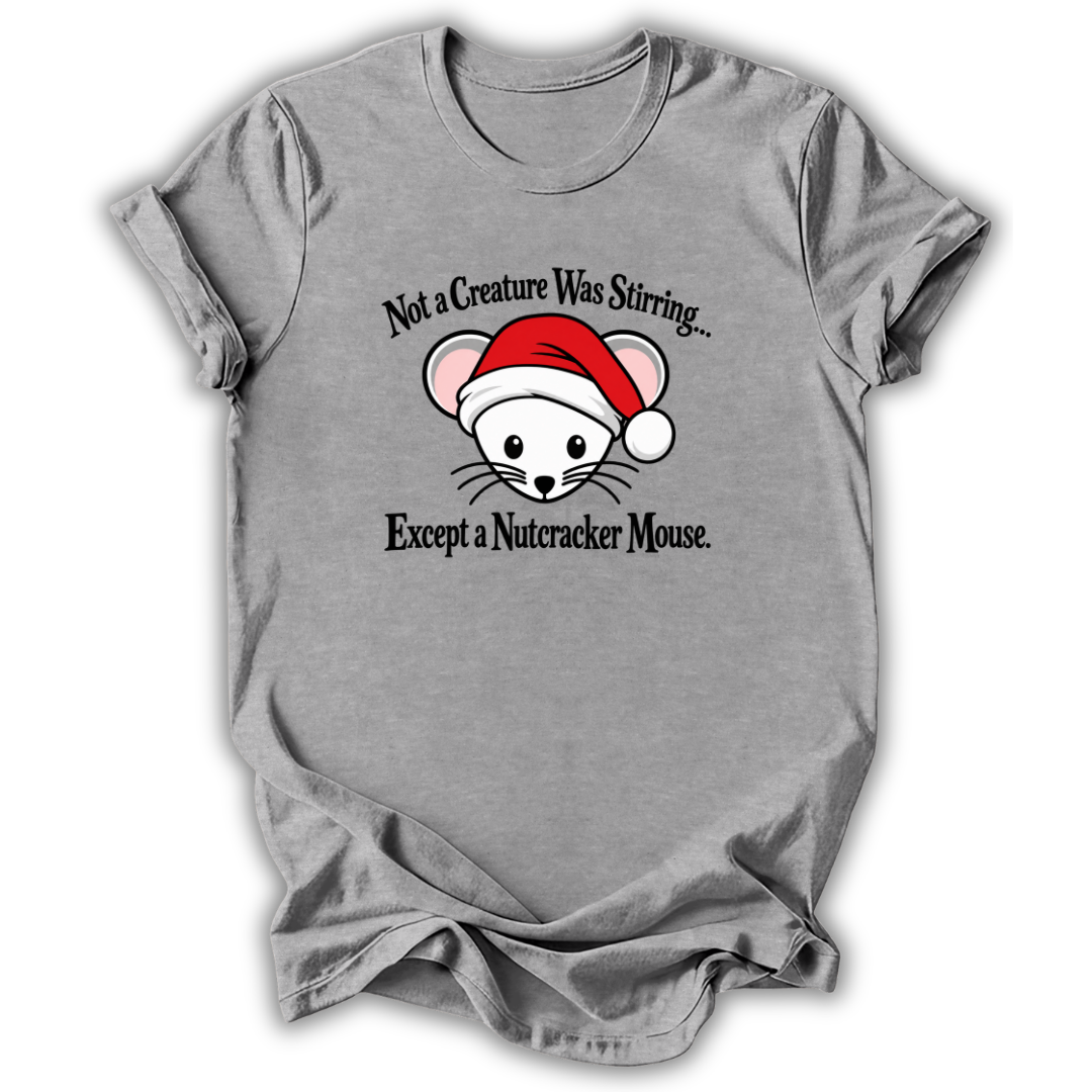 A heather gray short-sleeve t-shirt with a graphic of a white nutcracker mouse wearing a red Santa hat, with the text 'Not a Creature Was Stirring.