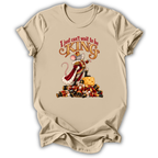 A beige short-sleeve t-shirt with a graphic print of a mouse dressed as a king standing on a pile of candy canes and a cheese wedge, with the text 'I just can't wait to be KING'.