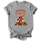 A heather gray short-sleeve t-shirt with a graphic print of a mouse dressed as a king on a pile of gold coins, with the text 'I just can't wait to be KING' above it.