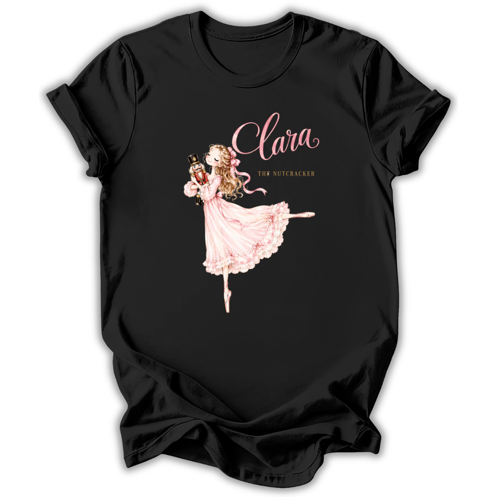 A black short-sleeve t-shirt with a graphic print of Clara the Nutcracker ballerina in a pink dress, with the text 'Clara' and 'THE Nutcracker' on a white background.