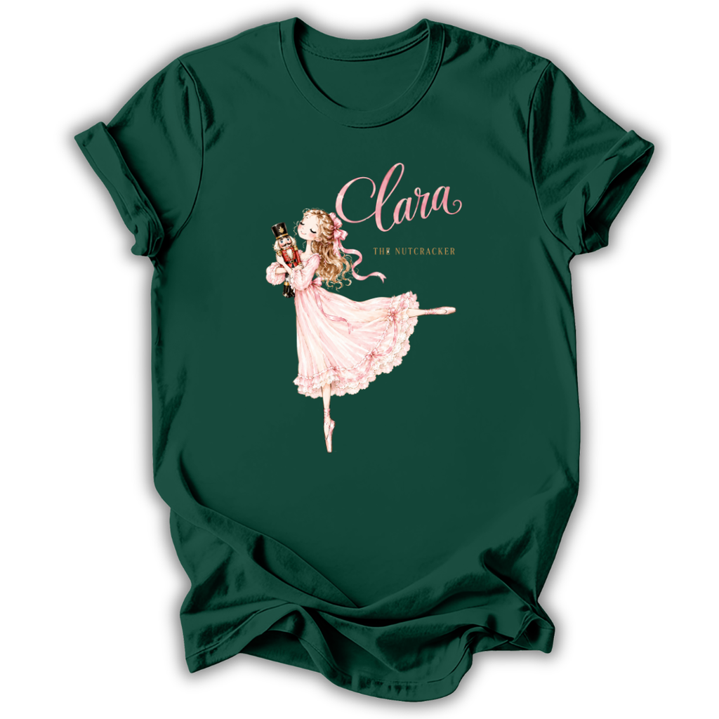 A dark green short-sleeve t-shirt with a graphic of Clara the Nutcracker ballerina in a pink dress, with the text 'Clara THE Nutcracker' printed on the front.