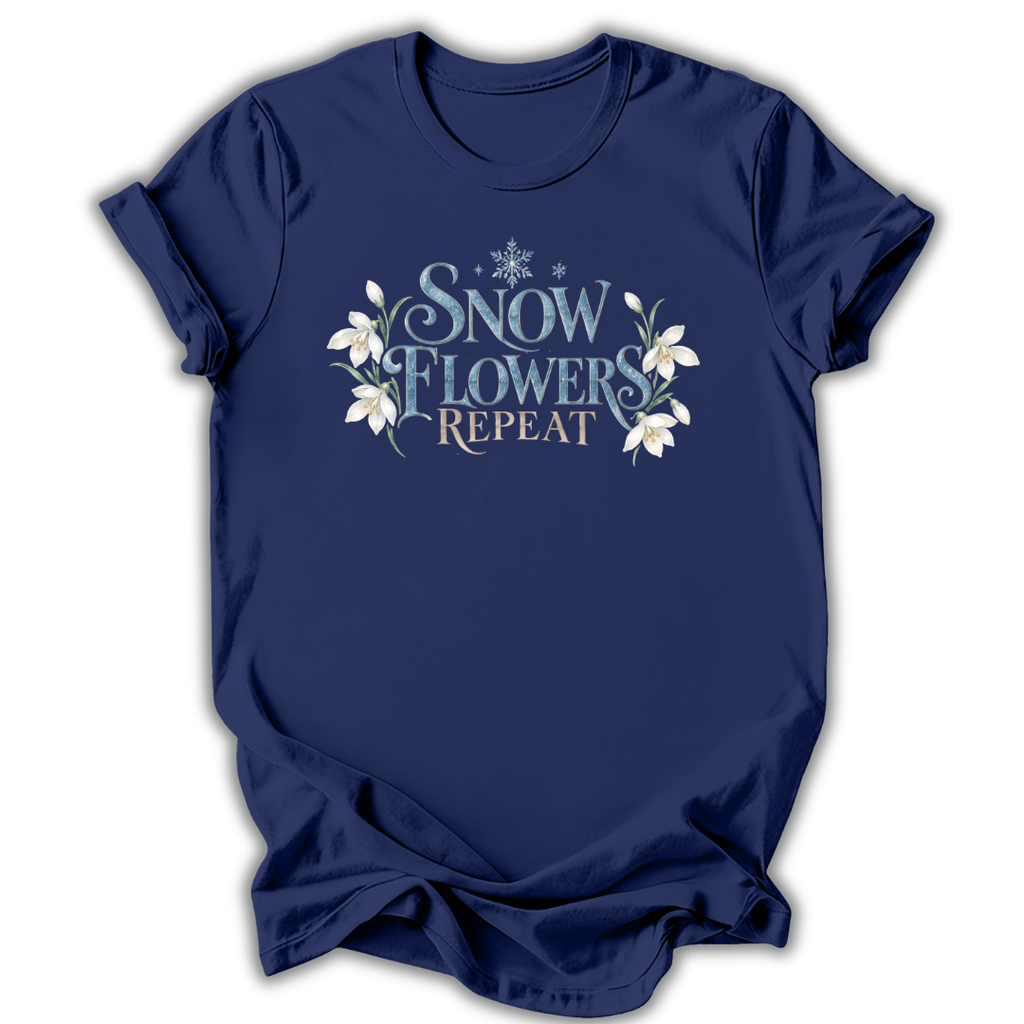 Navy short-sleeve t-shirt with a graphic on the chest that reads 'SNOW FLOWERS REPEAT' in blue and gold lettering, decorated with white snowflakes and flowers, shown on a white background.