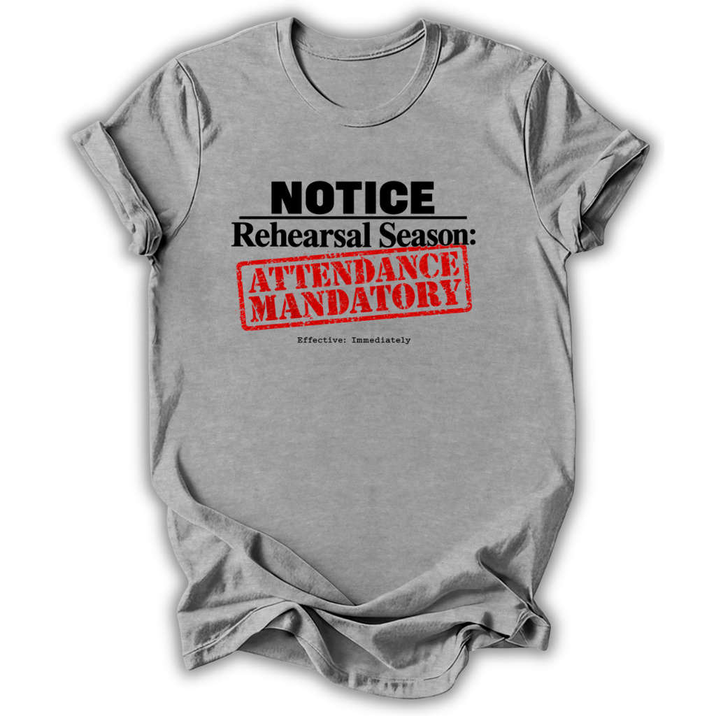 A heather gray short-sleeve t-shirt with a graphic print that reads 'NOTICE Rehearsal Season: ATTENDANCE MANDATORY' in black and red text, shown on a white background with a soft drop shadow.