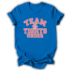 A royal blue short-sleeve t-shirt with a graphic on the front reading 'TEAM TIGHTS UNDER' in pink and white varsity-style lettering, with a small ballet dancer illustration in the center.