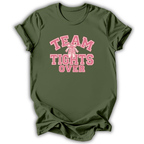 An olive green short-sleeve t-shirt with a pink graphic on the front that reads 'TEAM TIGHTS OVER' with a pink ribbon bow detail, displayed on a clean white background.