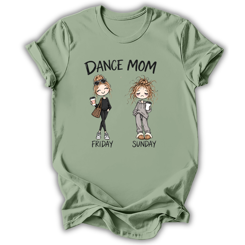 A sage green short-sleeve t-shirt with a graphic print that reads 'DANCE MOM' above two cartoon women labeled 'FRIDAY' and 'SUNDAY'. The shirt is shown flat against a white background with a soft drop shadow.