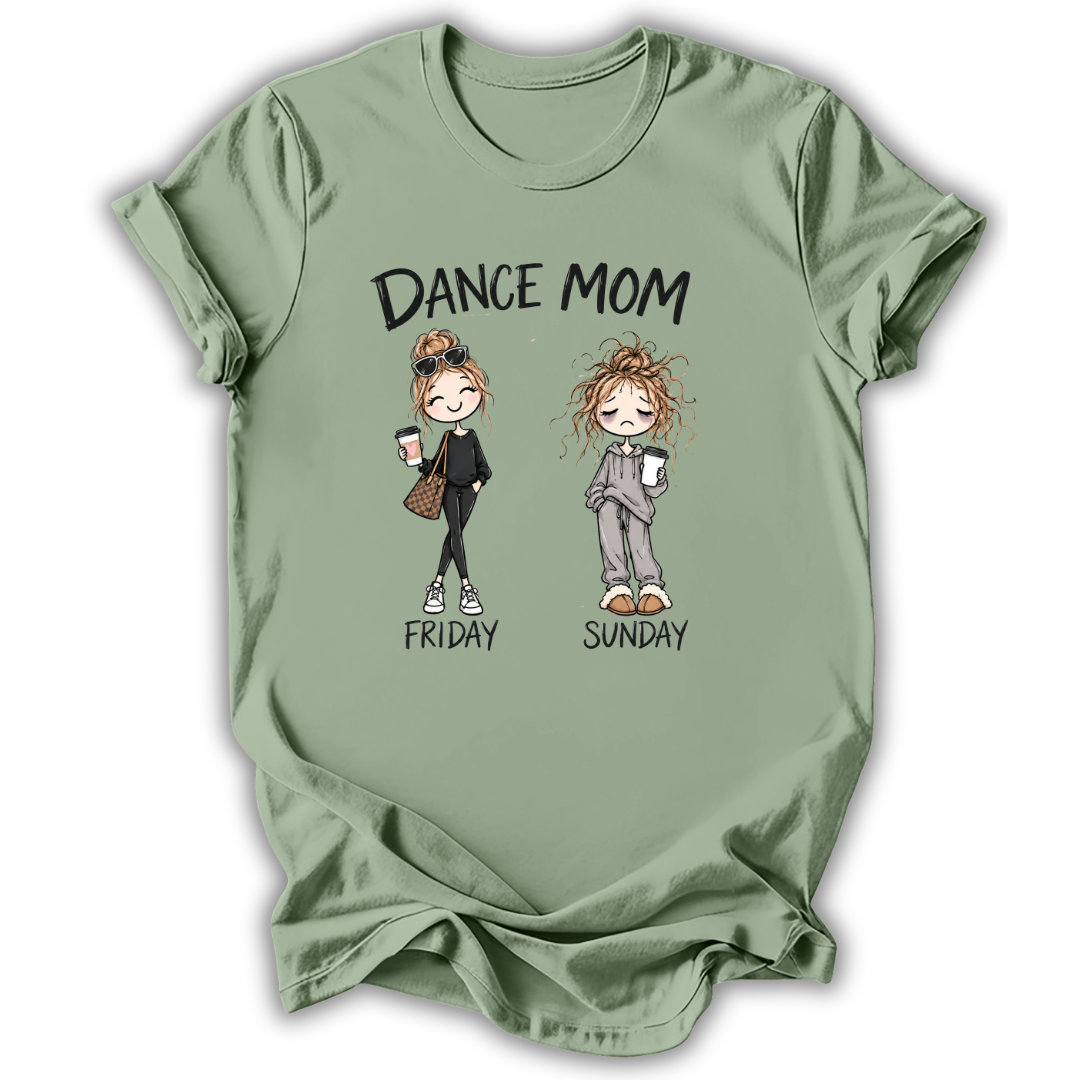 A sage green short-sleeve t-shirt with a graphic print that reads 'DANCE MOM' above two cartoon women labeled 'FRIDAY' and 'SUNDAY'. The shirt is shown flat against a white background with a soft drop shadow.