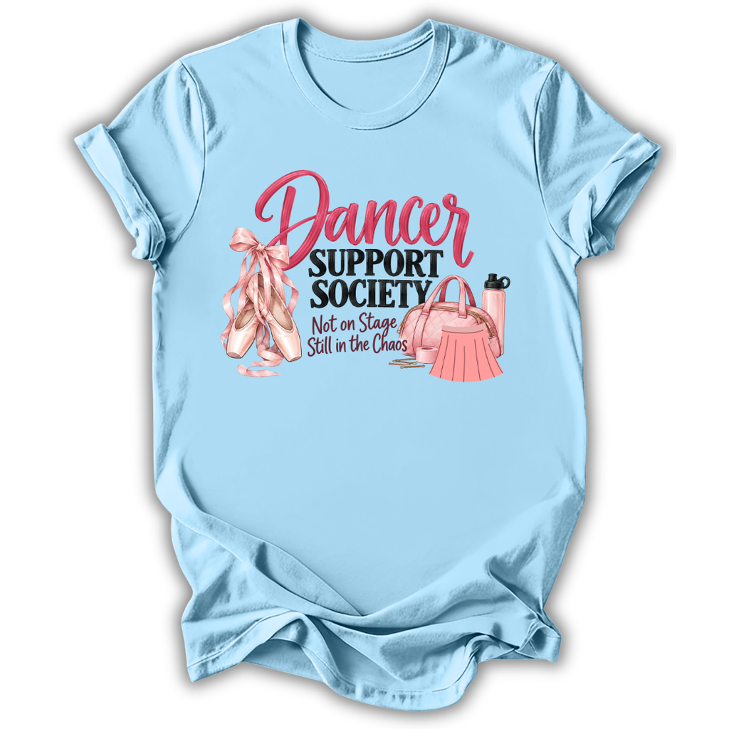 A light blue short-sleeve t-shirt with a graphic print that reads 'Dancer Support Society Not on Stage Still in the Chaos' in pink and black text, accompanied by illustrations of pink ballet slippers, a pink dress, and a pink purse.
