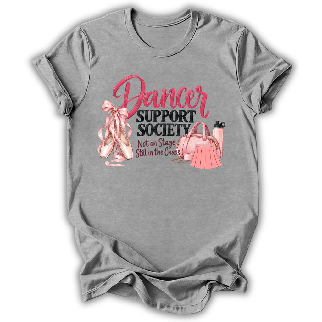 A heather gray short-sleeve t-shirt with a pink graphic print that reads 'Dancer Support Society Not on Stage Still in the Chaos' alongside ballet slippers, a handbag, and a water bottle.