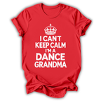A red short-sleeve t-shirt with a white graphic print featuring a crown and the text 'I CAN'T KEEP CALM I'M A DANCE GRANDMA' on a white background.