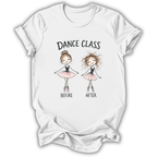 A white short-sleeve crewneck t-shirt featuring a graphic print of two cartoon ballerinas labeled 'DANCE CLASS BEFORE AFTER'. The 'after' ballerina has curly hair and wears a pink tutu, while the 'before' ballerina has a bun and wears a pink tutu.
