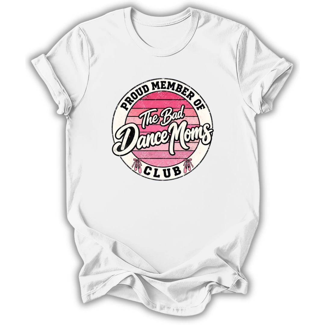 A white short-sleeve crewneck t-shirt with a circular graphic on the chest that reads 'PROUD MEMBER OF The Bad Dance Moms CLUB'. The graphic features a pink striped circle in the center with white script lettering and black text.