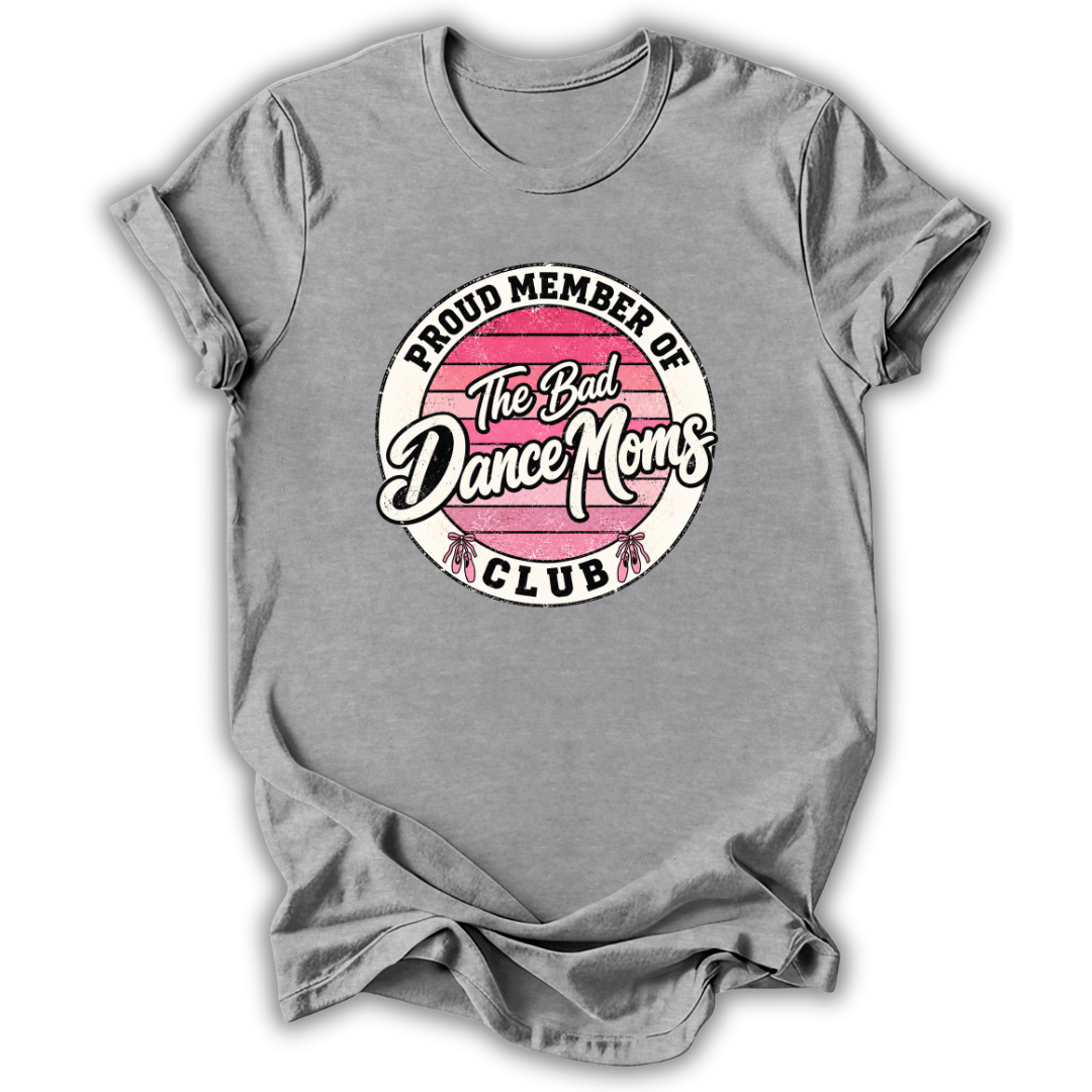 A heather gray short-sleeve t-shirt with a circular graphic on the chest that reads 'PROUD MEMBER OF The Bad Dance Moms CLUB'. The graphic features a pink striped circle with white and black lettering.