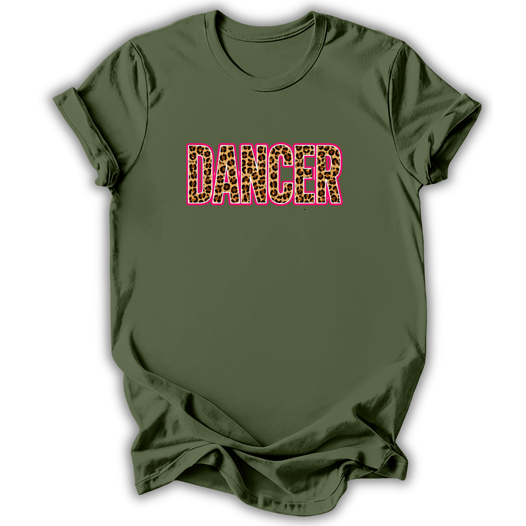 An olive green short-sleeve t-shirt with the word 'DANCER' printed across the chest in a leopard-print pattern outlined in pink, shown on a white background.