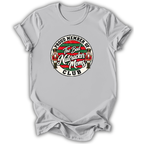 A light gray short-sleeve crewneck t-shirt featuring a circular graphic on the chest that reads 'PROUD MEMBER OF The Bad Nutcracker Moms CLUB' with nutcracker figures and red, green, and white details.