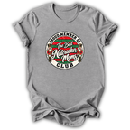 A heather gray short-sleeve t-shirt with a circular graphic on the chest that reads 'PROUD MEMBER OF The Bad Nutcracker Moms CLUB' with nutcracker figures and red, green, and white details.