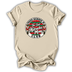 A beige short-sleeve t-shirt with a circular graphic on the chest that reads 'PROUD MEMBER OF The Bad Nutcracker Moms CLUB' with nutcracker illustrations.