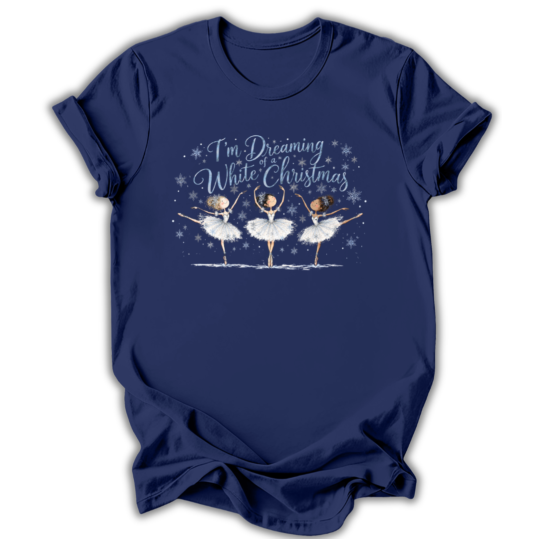 Navy short-sleeve t-shirt with a graphic print of three ballerinas and the text 'I'm Dreaming While Christmas' in blue and white, displayed on a clean white background.
