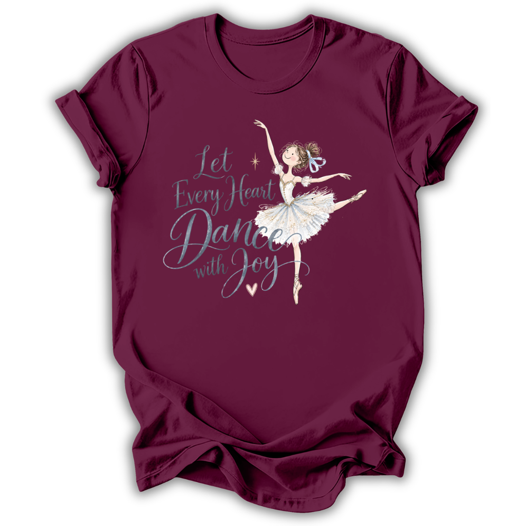 A maroon short-sleeve t-shirt with a graphic of a ballerina and the text 'Let Every Heart Dance with Joy' in white and light blue, displayed on a clean white background.